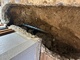 A worker is installing a thermal head on the home heating system distributor.